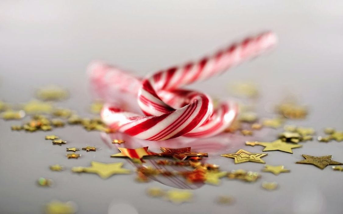 A box of golden honey bonbons with delicate hand-rolled finish